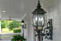 Charming lantern lighting enhances the timeless front porch.