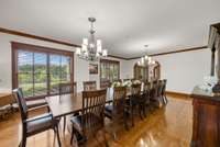 Spacious formal dining room with seating for gatherings large or small. Plenty of room even for this 16 seat dining room table!