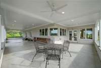 The side patio connects beautifully to the breakfast room, extending your living and entertaining space. A truly great place to have your morning coffee.