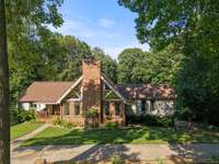 This Home’s front yard consist of a circular drive and a side drive way to the rear garage space.