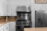 Six burner chef stove with stainless steel griddle.