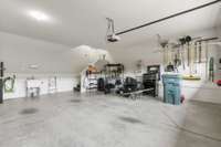 The sellers added a free standing utility sink in the garage.