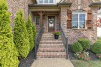 Just a few steps into this beautiful home and a porch that is beautiful on its own or makes a a great spot for your favorite outdoor seasonal decor.
