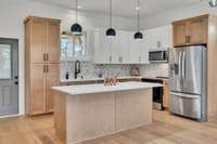 Kitchen Leads Outside To A Covered Deck!