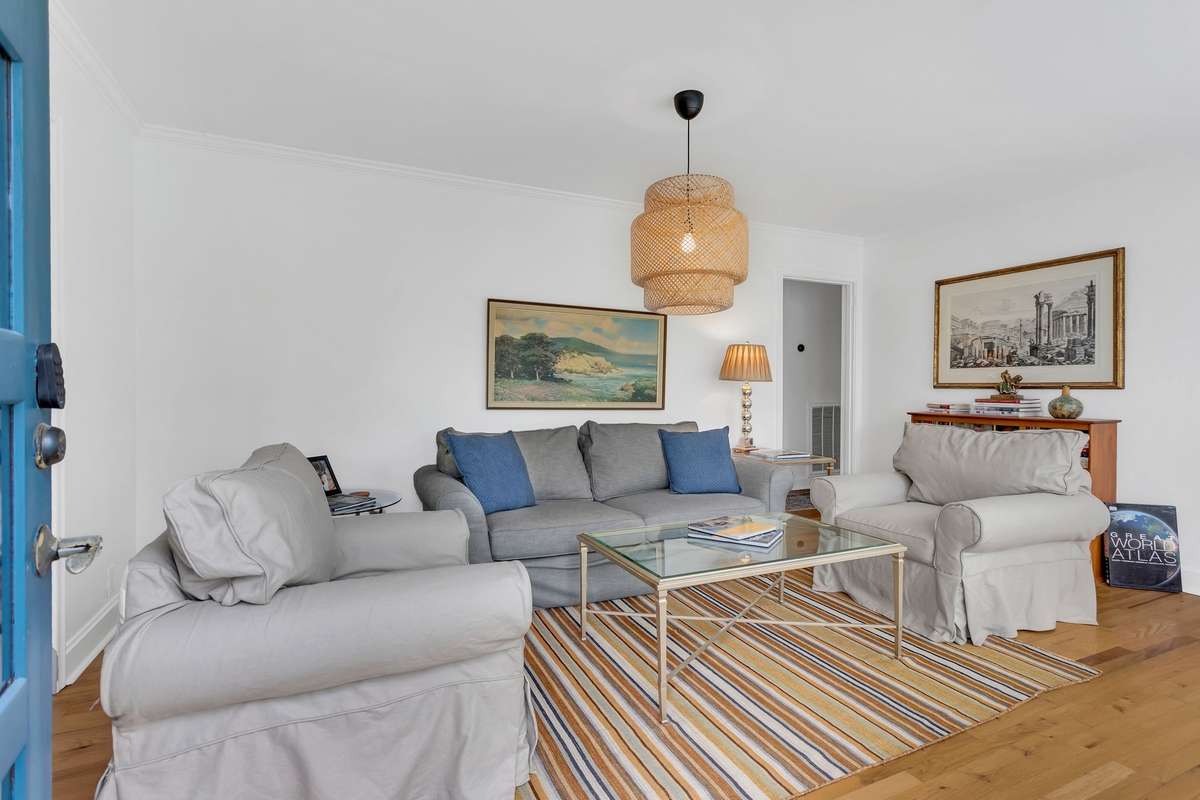 Enter the home into the living room with an abundance of natural light. 2” wood blinds on all of the windows in the home.