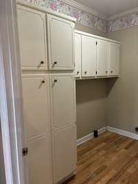 Built-in cabinets add extra storage space in your utility room.