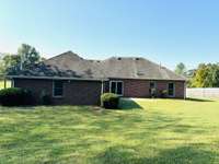 This picture shows the back of your home from the backyard.