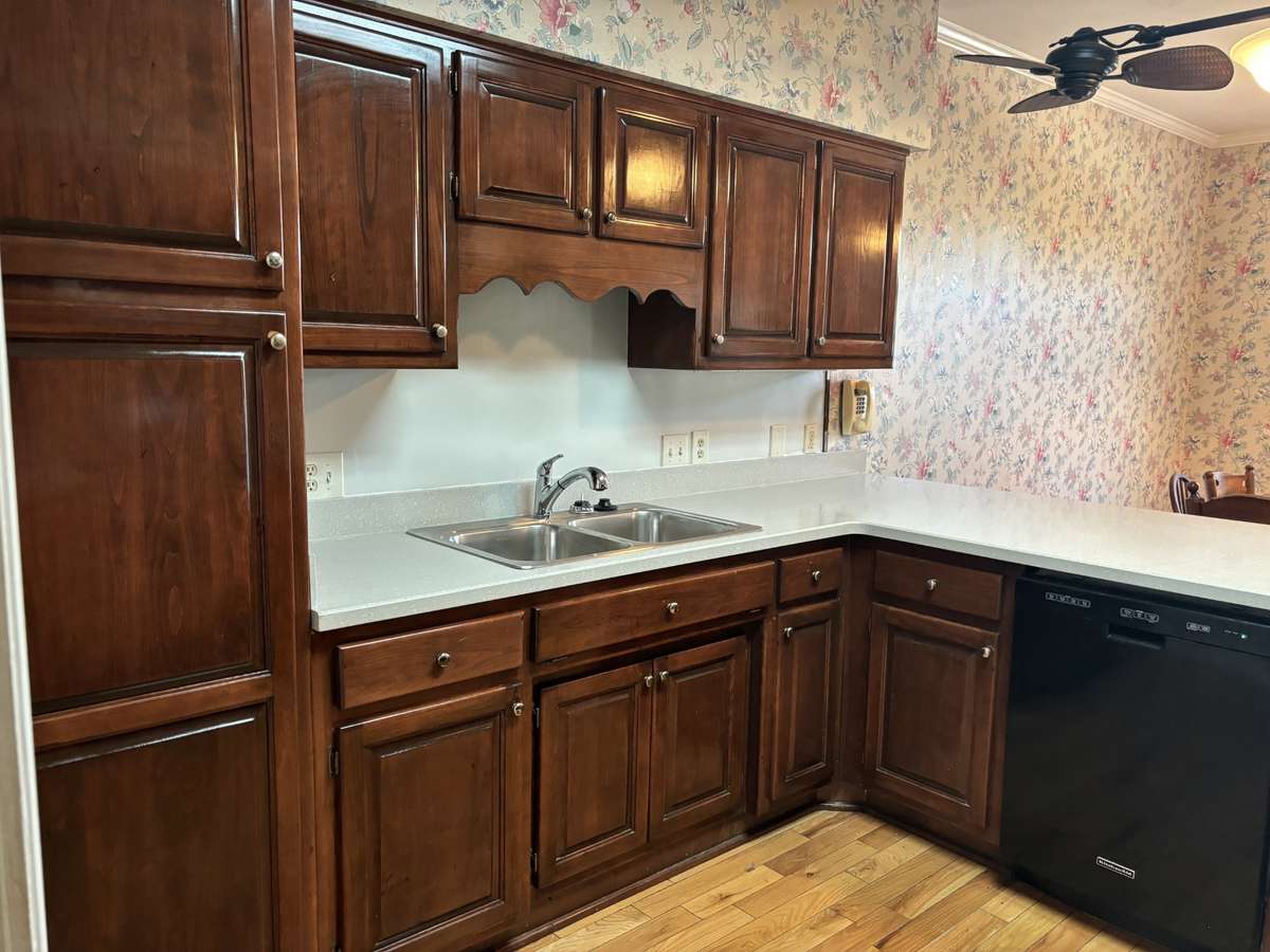 Beautiful cabinets  are abundant in your kitchen. A 50/50 stainless sink and expansive counters make food prep and cleanup a breeze.