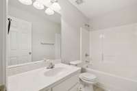 Guest bathroom with single vanity, tile floors, & combo tub & shower. 1013 Wigan Dr Murfreesboro, TN 37130