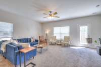 Door leads to fully fenced patio.