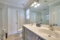 Double sinks in the en suite bath.