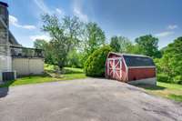 Lots of additional parking and a view of the attached barn that stays with the property.