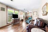 Living Room as  you enter the home.  Notice the beautiful hardwood flooring which is throughout the entire main living area.