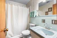 Full Bathroom with a full walk-in shower.  Located on the main living area and serves all three Bedrooms.