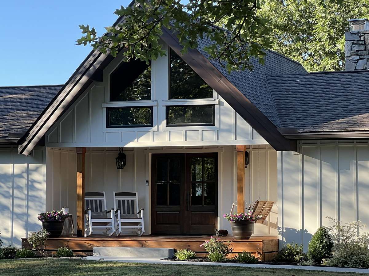 Inviting front porch freshly stained ready for years of use. Swing on front porch can convey. Swing is the perfect spot to enjoy the breathtaking sunrise and enjoy your morning coffee!