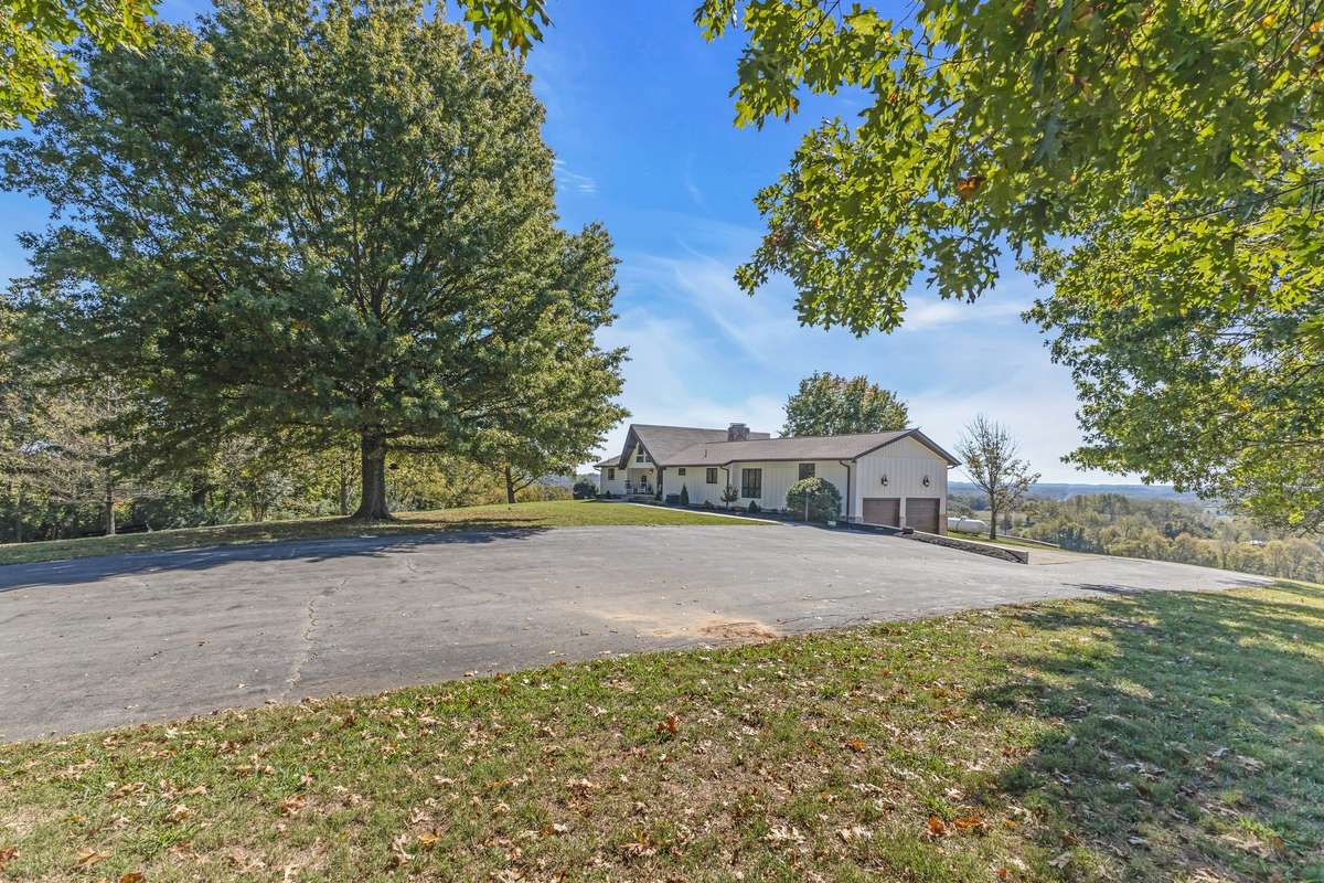 Extra space for parking, this house has it! Side of the home has a 2 car garage with a 50 amp service just outside and a 21x21 floored attic above it which can be easily used for storage or converted into additional living space!