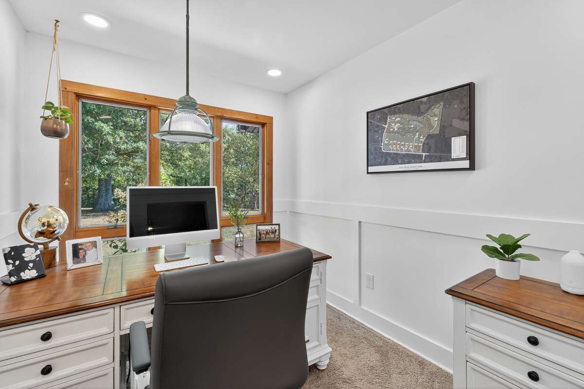 Private office space off the primary bedroom. The 1900's light fixture sets the tone for an inspiring work place. Not to mention the stunning view of the front yard! Working from home brings on a whole new meaning!