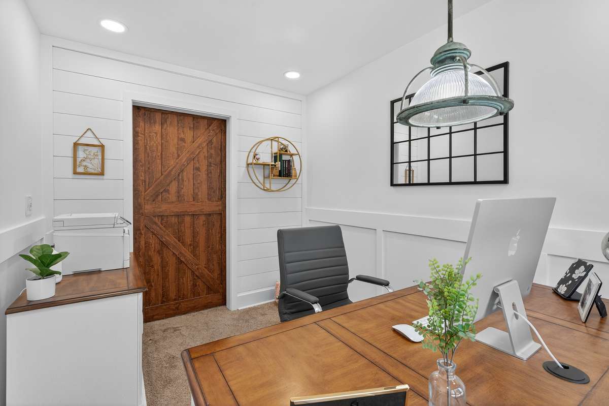 Shiplap wall and sliding barn door make your new office one you will enjoy! This space is tucked away from the rest of the home making it easy to have virtual meetings without all the household noise.