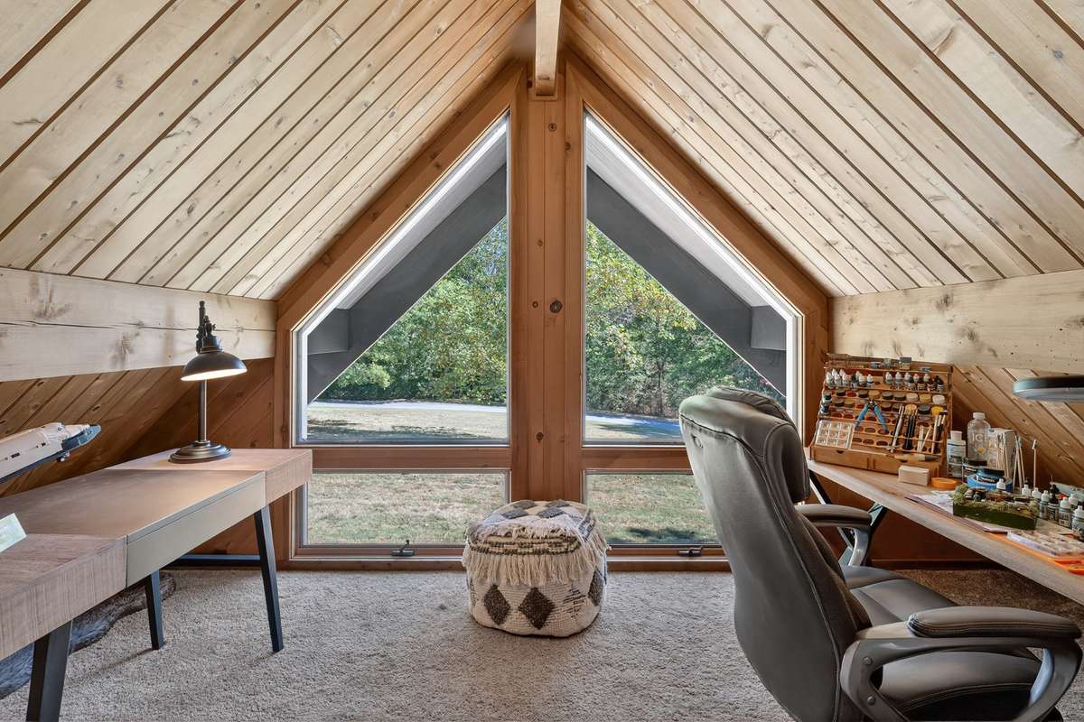Loft space is currently used as an office/man cave. This loft does have a door to close it off from the rest of the home.