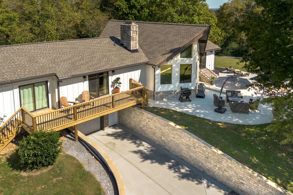 Beautiful stone retaining walls line the driveway to the basement.