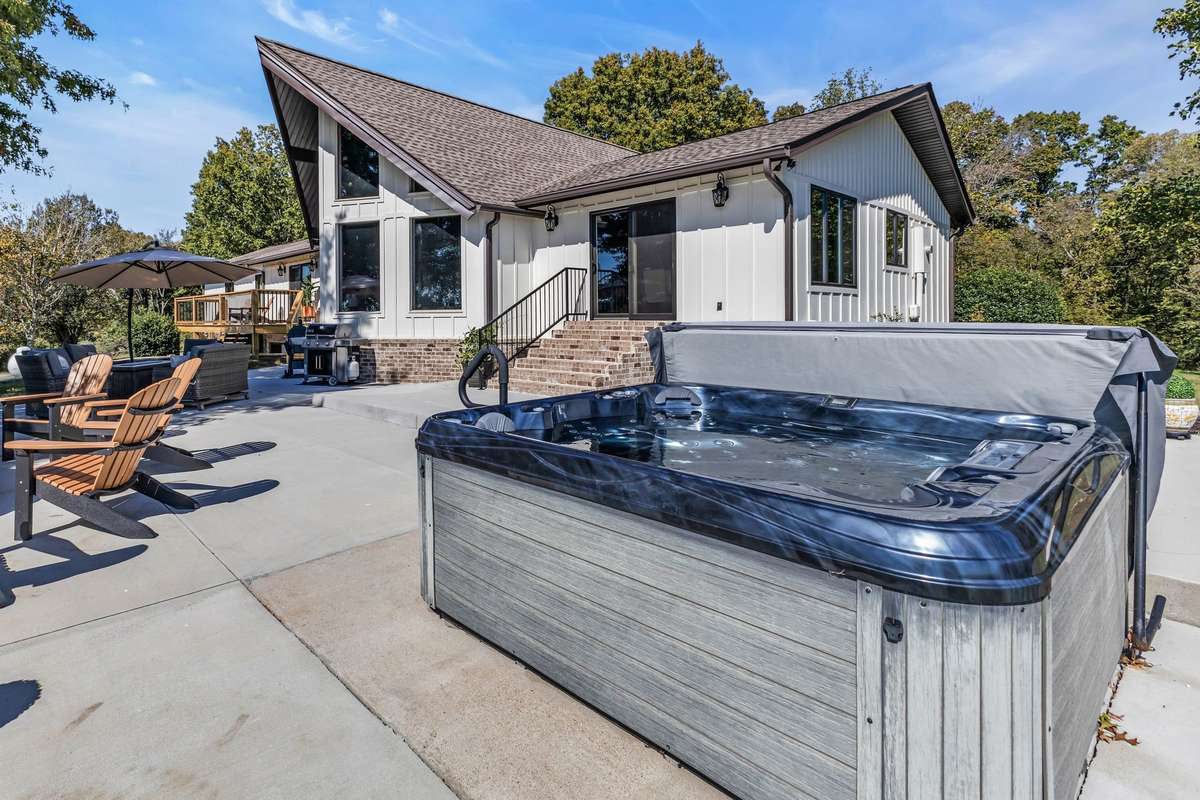 Enjoy any time of the day in the hot tub! Hot tub conveys with the property.