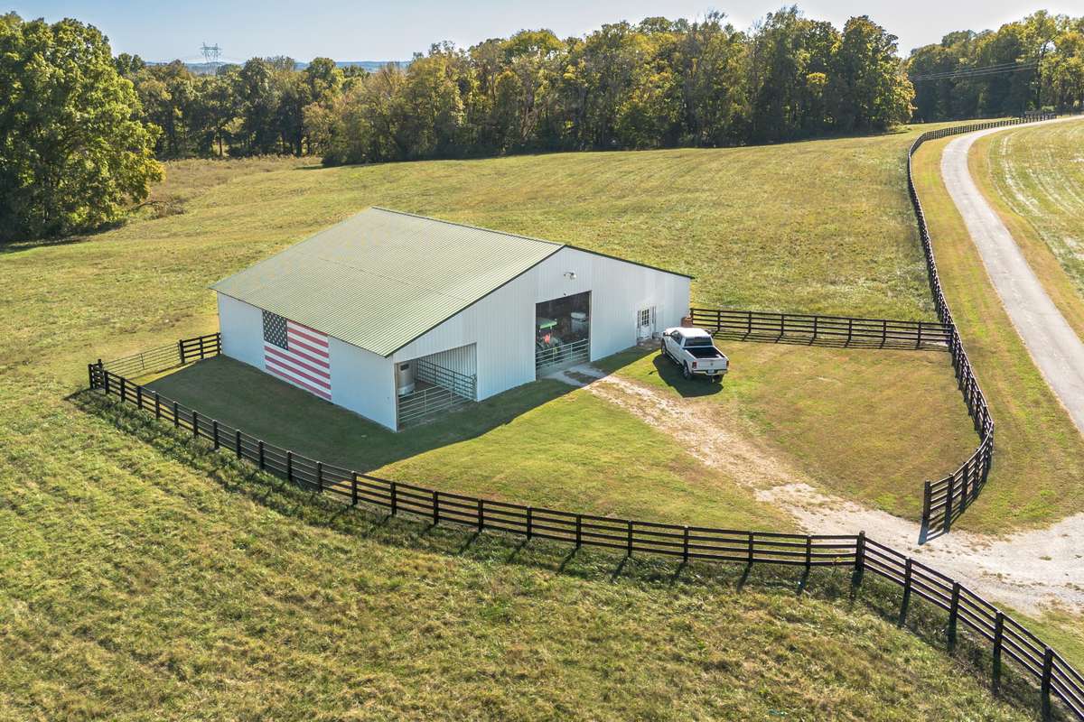 This 60x70 metal barn built with steel beams, perfect for equipment, hay storage, even convert  to an event space or barndo. This barn has 2 storage areas, one on the left side and one on the back side. Barn has electricity/lights ( 50 amp hookup ).