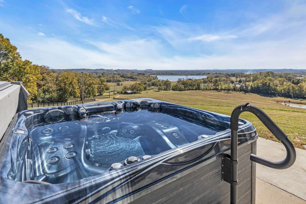 Well maintained hot tub has a newer cover.