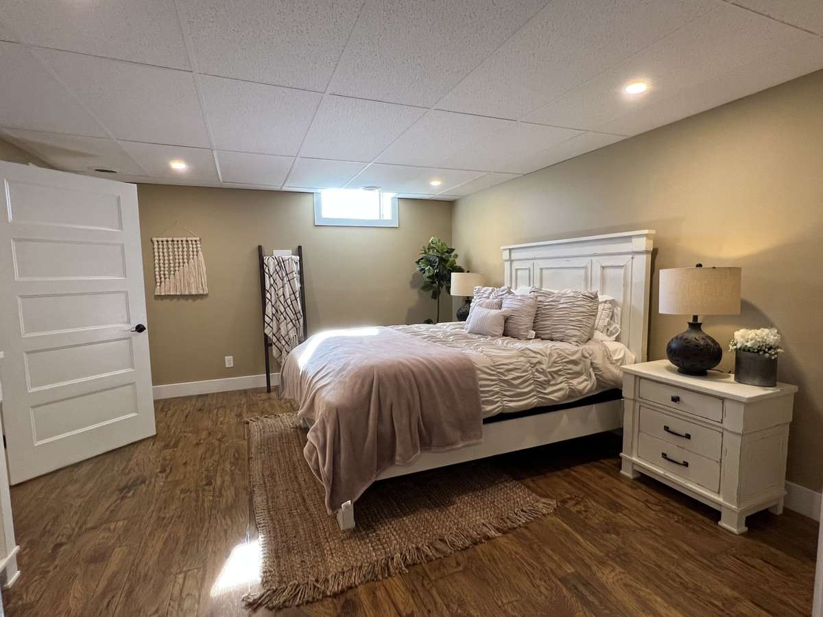The oversize basement bedroom has natural light! Perfect room for in-law suite, teen or guests. Room has a full walk-in closet as well.