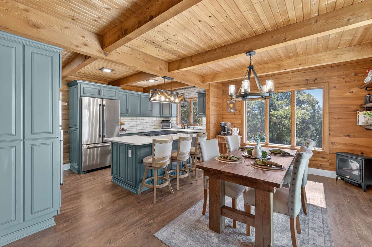 Kitchen has been updated with new cabinets, quartz countertops, old chicago style brick backsplash and high end appliances.