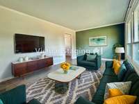 Virtually staged Living Room.  This home has a real coat closet! Rare find!