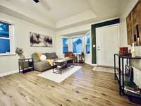 Flex room facing bay window and back door.