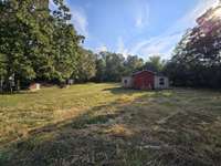 Barn with electricity - Property extends all the way back to tree line.