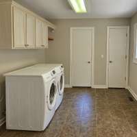 Laundry Room Area - You have garage access, backyard access, a half bath & storage closet right off the laundry room area