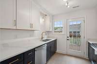 There is pretty lighting in the kitchen in addition to an overhead light at the kitchen sink, too!