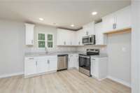 Kitchen with Granite Countertop, Kitchen window overlooks the wooded backyard
