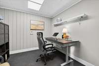 Next to the garage doors on the lower level there is an exterior entrance that accesses this office space.  It is a great place for a hobby room or a home business.  It is heated and cooled by a mini-split.