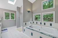 After a long day, you're invited to soak in the large jet tub in ambiance