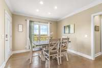 Breakfast nook in eat-in kitchen - Virtually staged to show furniture placement options