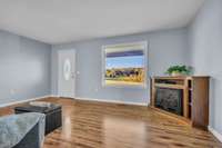 Another living room view showing the large picture window