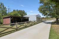 Storage barn for lawn equipment.  Additional building with living quarters.