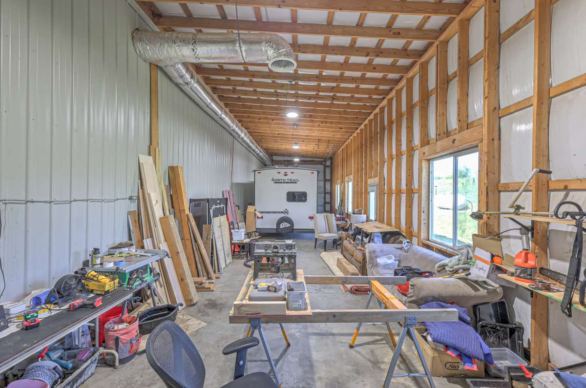 Large climate controlled shop with bay doors front and back.