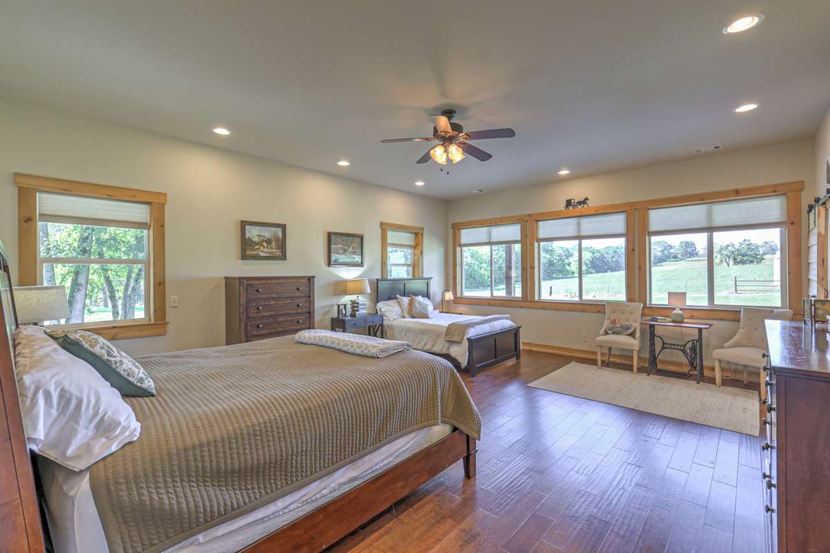 Large master bedroom with room for a sitting area.  Wake every morning to a beautiful view and horses grazing in the pasture.   Master BR has private master BA and large walk in closet