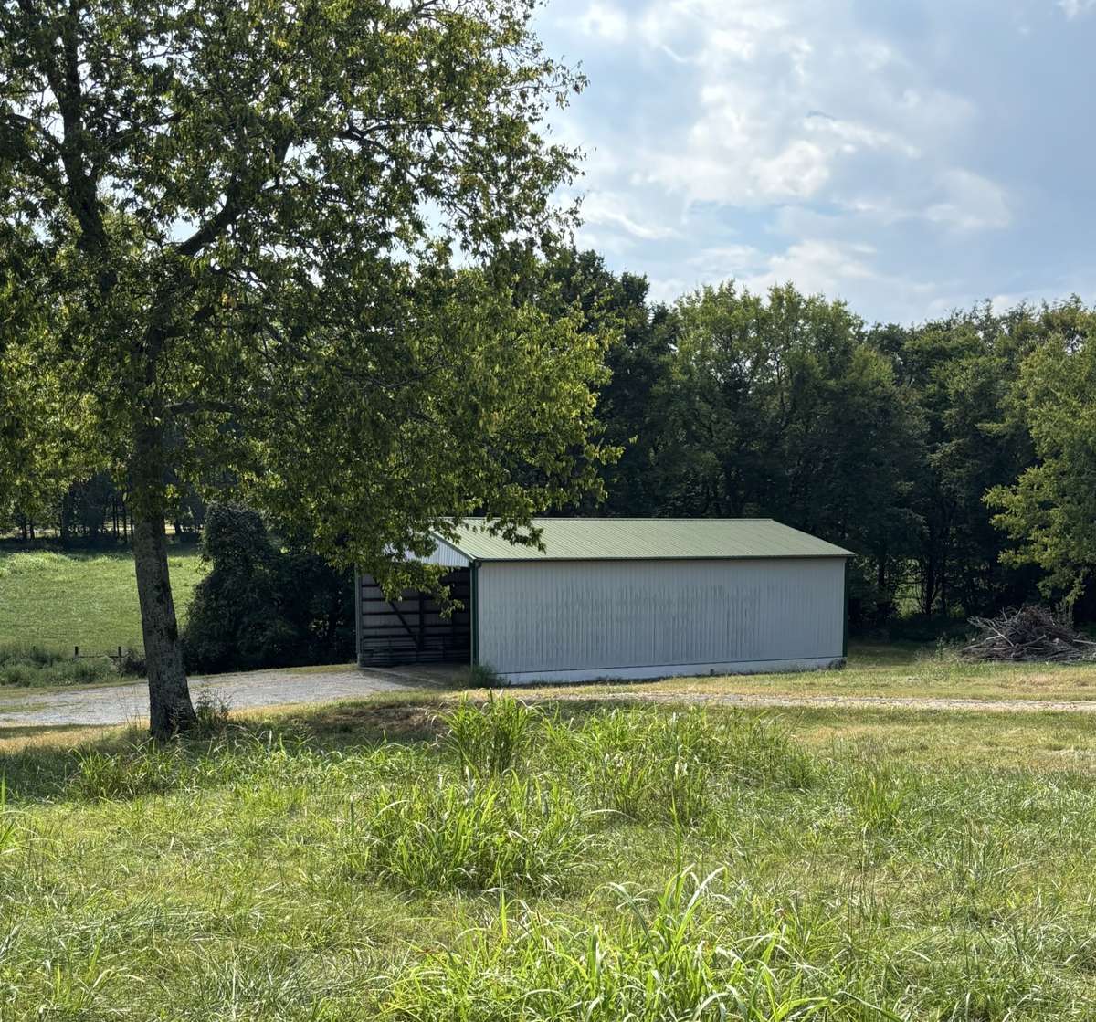 Metal barn with concrete floor and block foundation.
