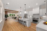 Spacious kitchen with quartz counters and a huge island