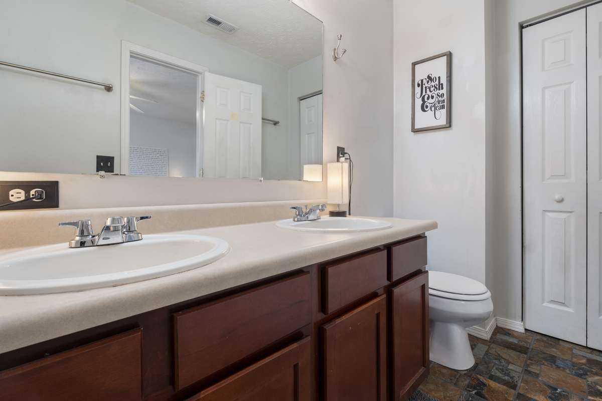 Complete with dual sinks, a tub and shower, and overhead lighting the primary bathroom has space for all your needs.