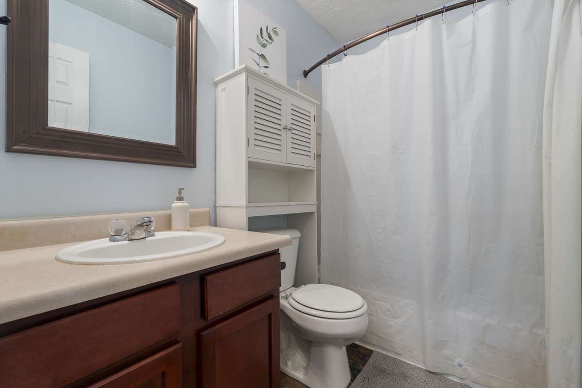 Off the bedroom, you will find a full bathroom complete with a shower/tub combo, a full sink and countertop with underneath storage, and over head cabinetry.