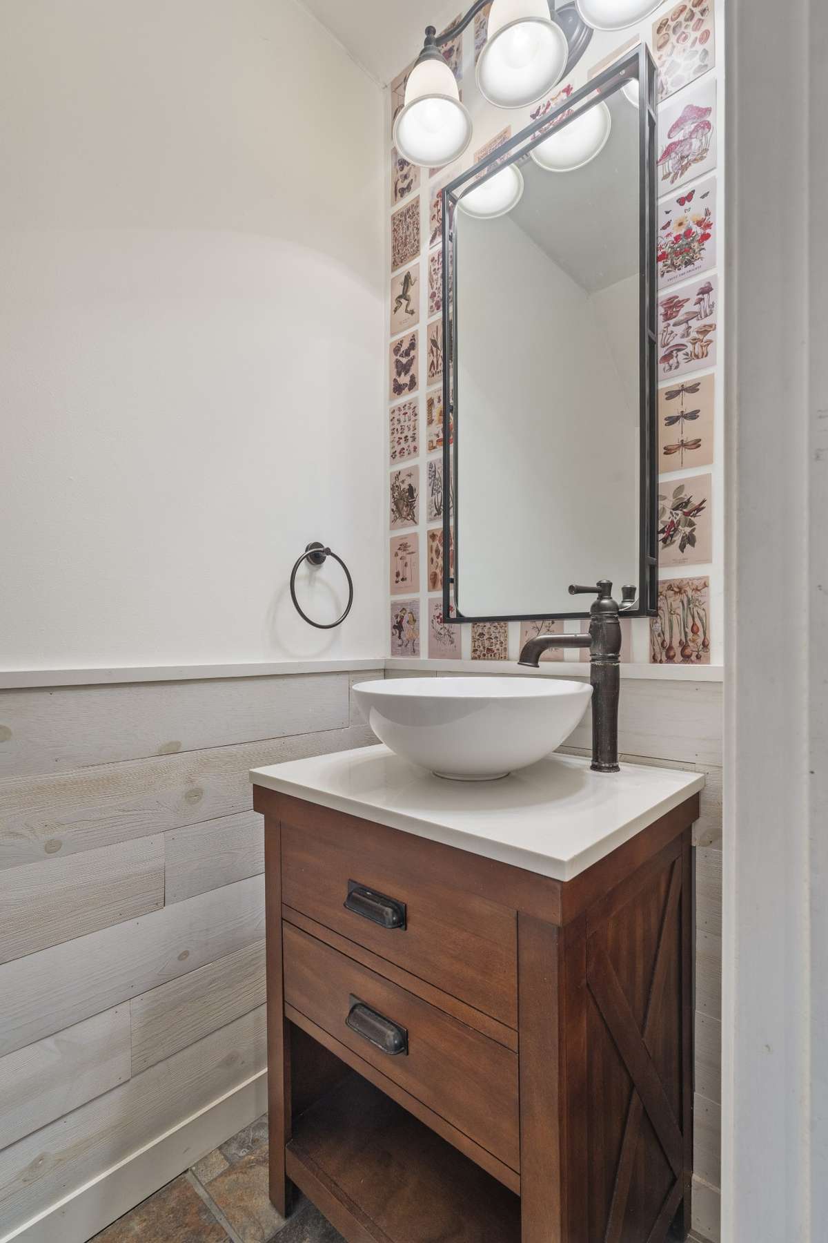 The hall bath offers a stand alone sink and counter.