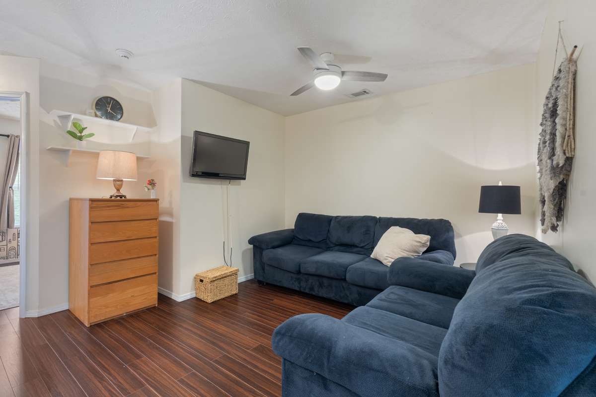 Upstairs, you will find a flex space complete with a ceiling fan and fresh paint.
