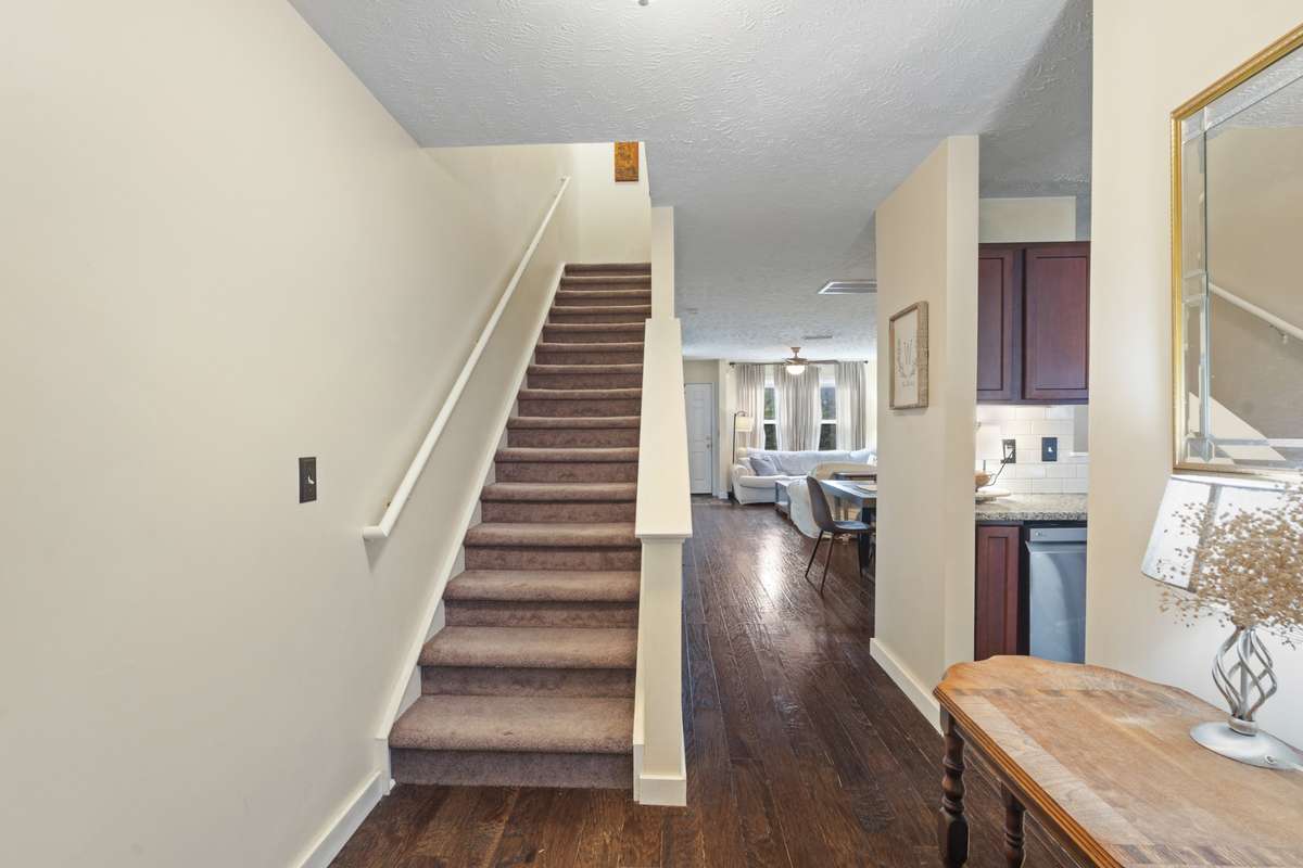 This amazing split level home is adorned with steps that lead to the upstairs.