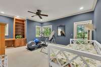 One of the three bedrooms on the first level with its own bathroom and deck to step out on to enjoy your morning coffee! Currently used as a workout room.